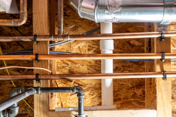 New copper and PEX water supply lines run through open wall framing