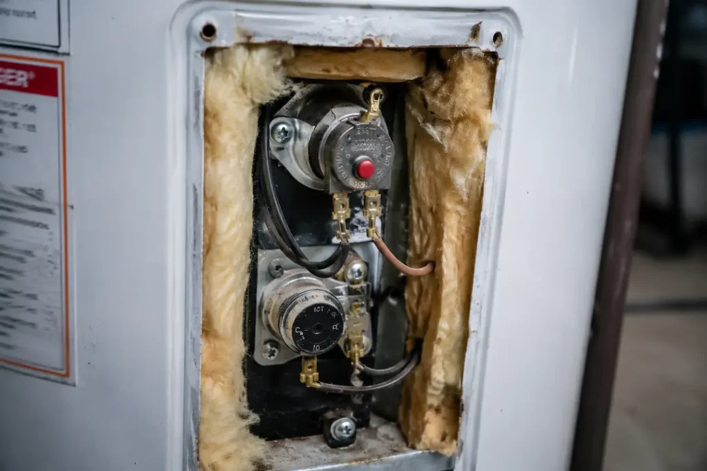 red reset button on an electric water heater that is not heating
