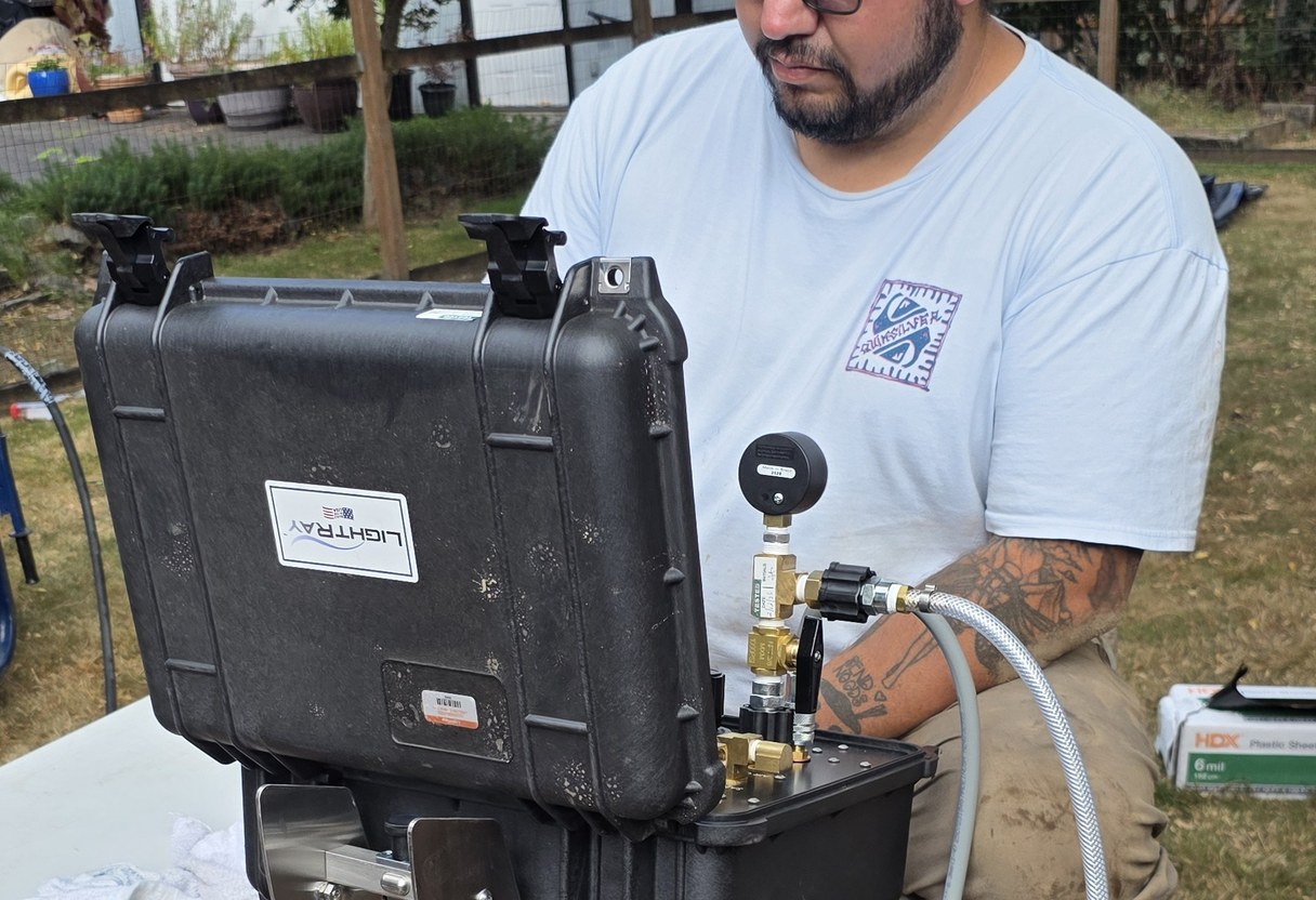 Danika technician at the UV curing controls during a side sewer lining job
