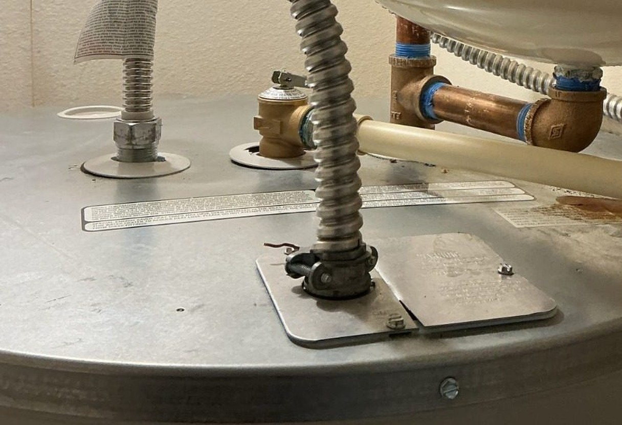 Water heater repiped in copper with braided flexible connectors